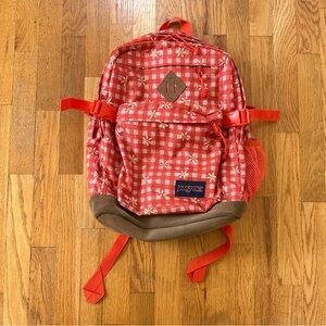 Jansport orange/red daisy gingham suede campus backpack